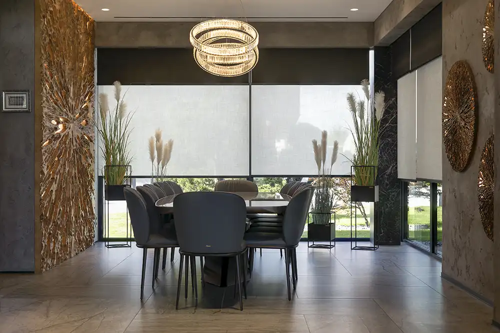 A modern dining room with a wooden table and chairs.