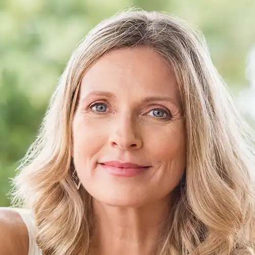 A woman with blond hair and blue eyes.